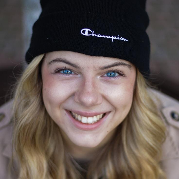 Avery Chen, Lead Design Curator at HarborFogRiver, reviewing corporate floral arrangements